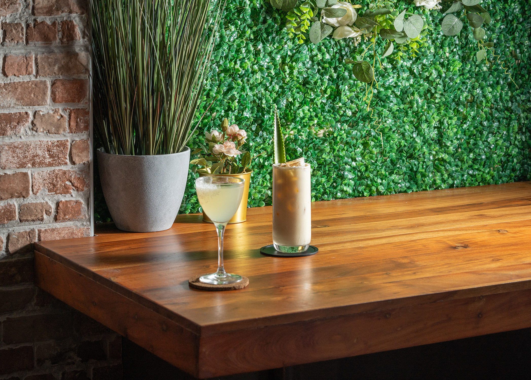 A margarita and a pina colada sat side by side in a bar